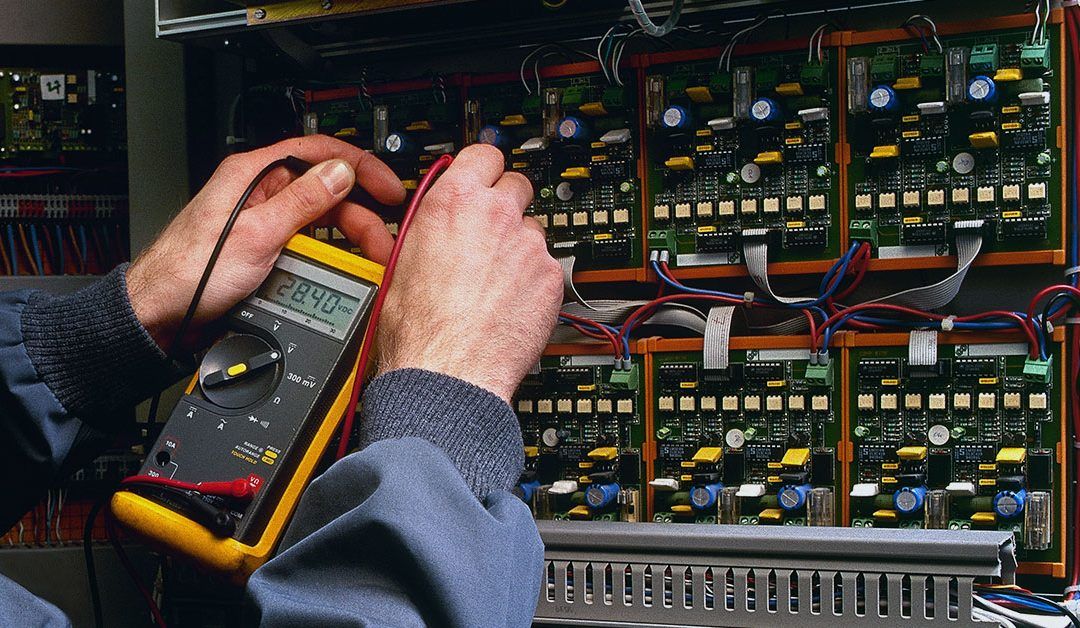 Electrician Testing Industrial Machine