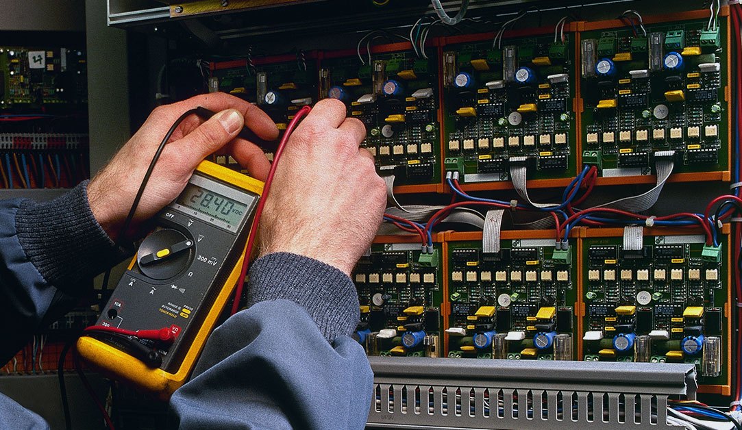 electrician-testing-industrial-machine Electrician Testing Industrial Machine